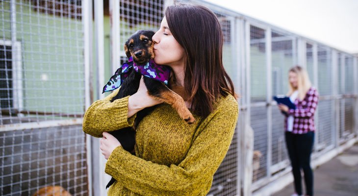 women holding dog